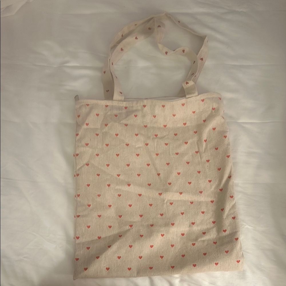 Heart patterned tan tote bag